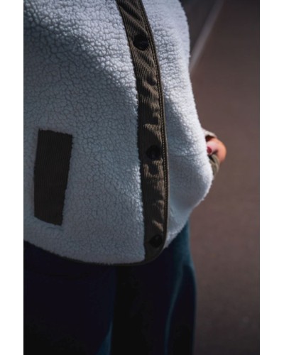 Veste sans manches en moumoute avec détails verts